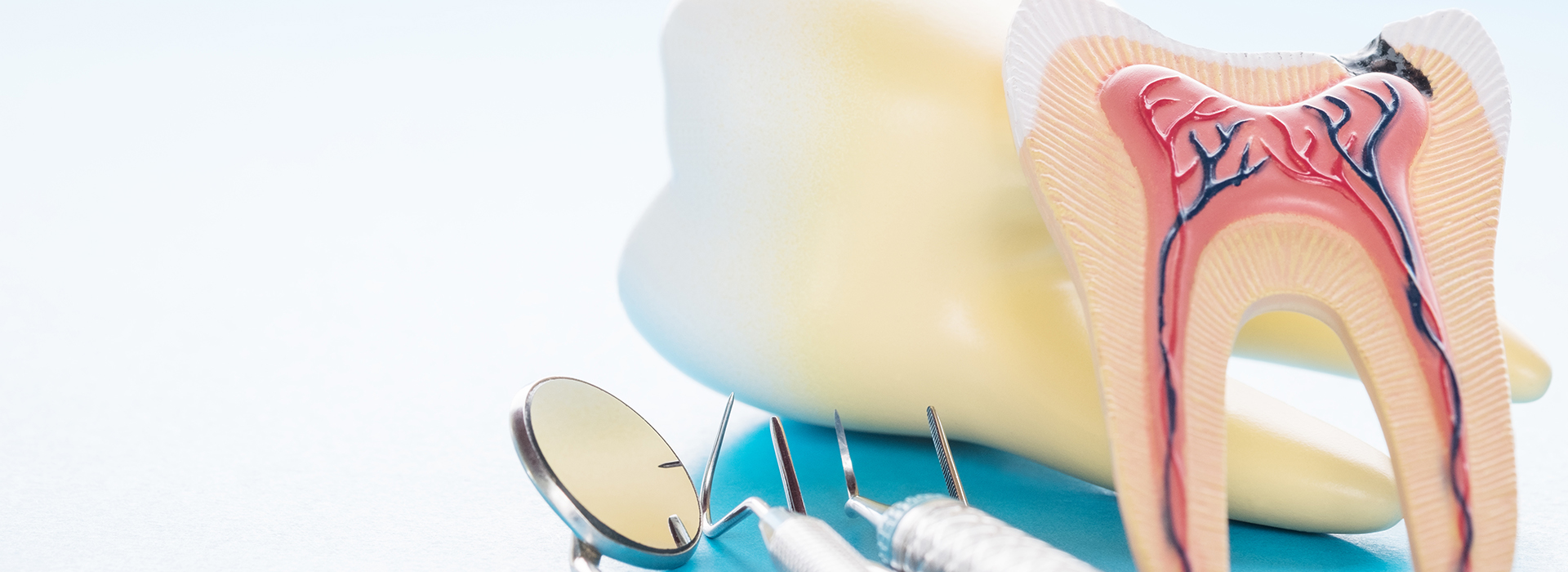 The image features two toothbrushes with toothpaste, placed on a surface next to each other.